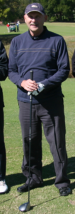 The Mosquito Joe of Melbourne's Certified Pest Control Operator standing with a golf club.